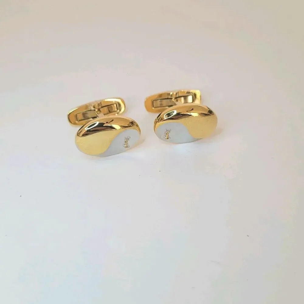 Yves Saint Laurent YSL Silver Gold Tone Oval Logo Cufflinks Retro Whale Back